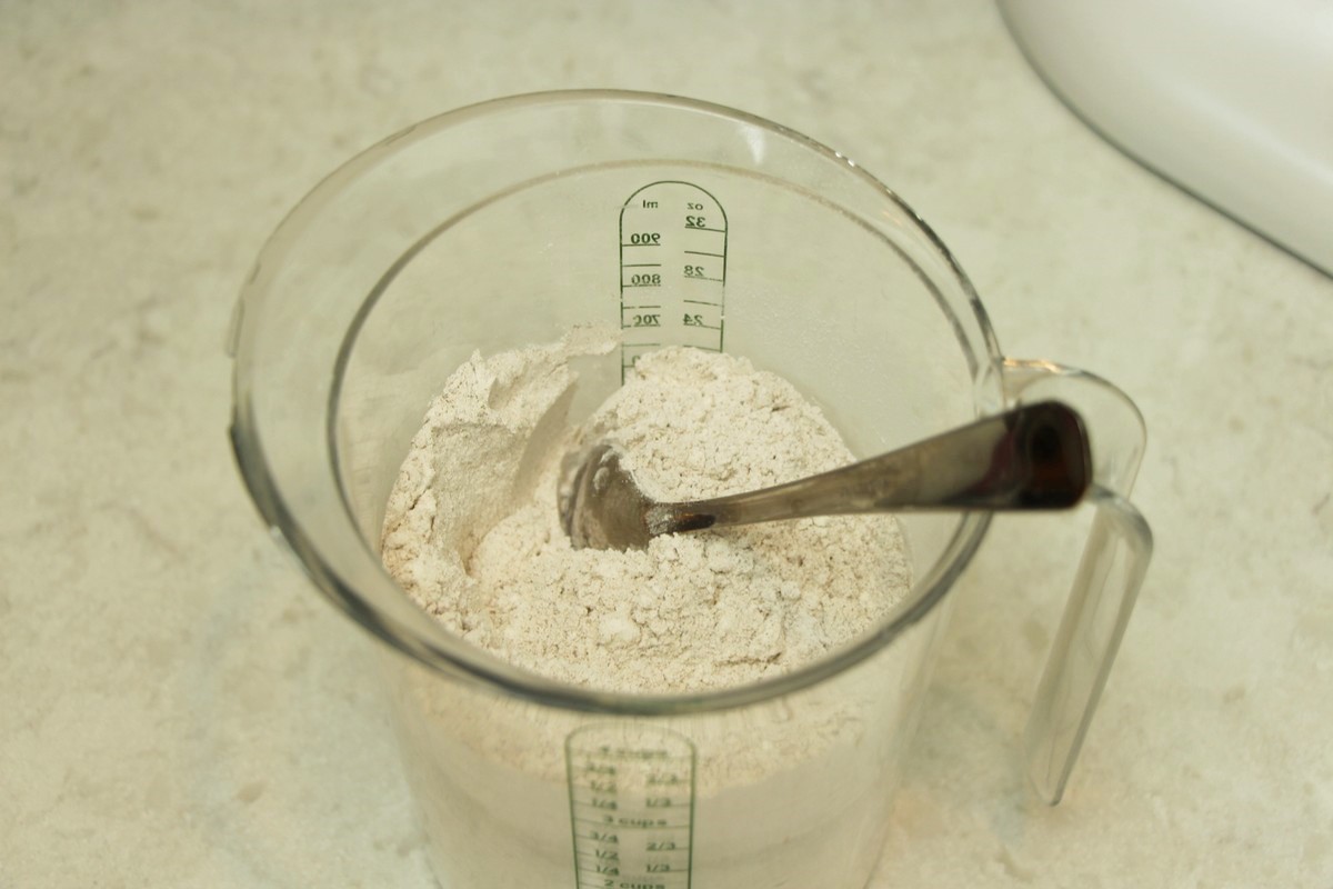 Mixing flour and other dry ingredients before mixing into cookie batter.