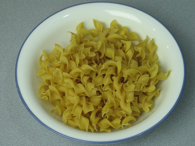Egg noodles in bowl, uncooked