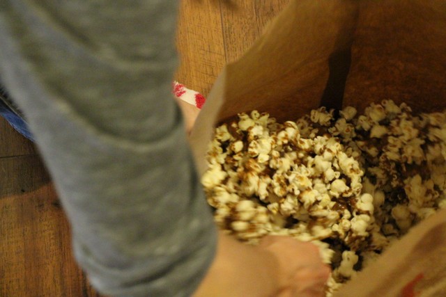 Caramel Corn Recipe, stirring popcorn with caramel sauce