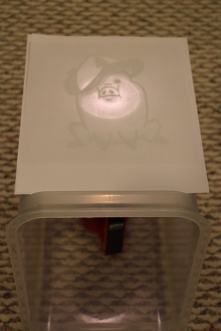 Tracing on Homemade Light Box; clear plasitc bin and flash light. 