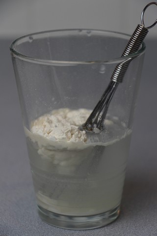 Mixing up water and flour for soup thickener