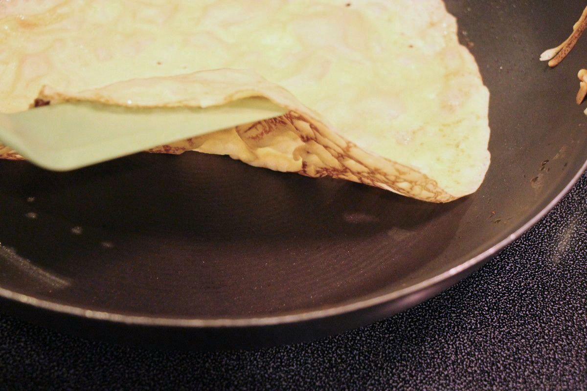 Making Norwegian pancakes, checking before flipping