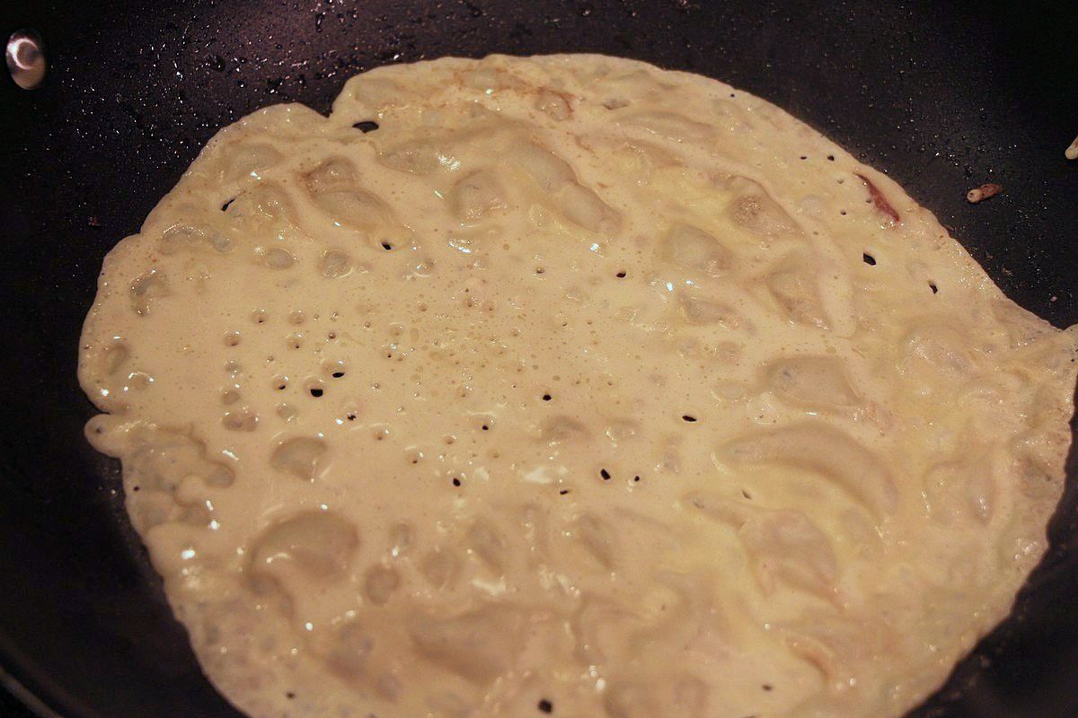 Norwegian pancake frying in skillet