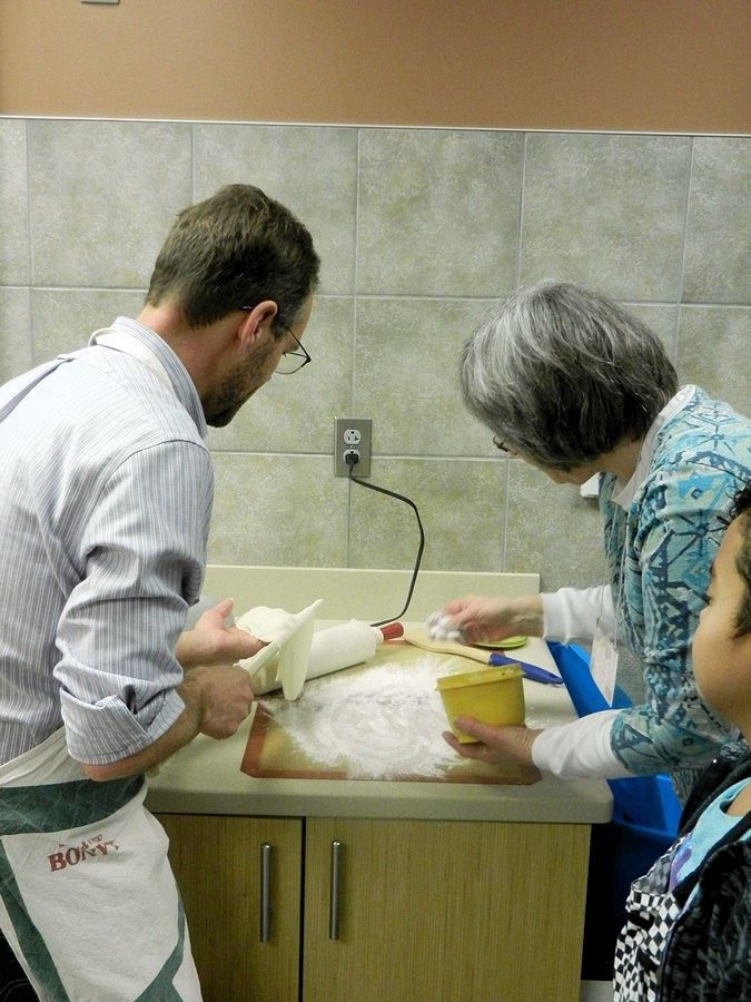 Sprinkling flour on pastry cloth for lefse