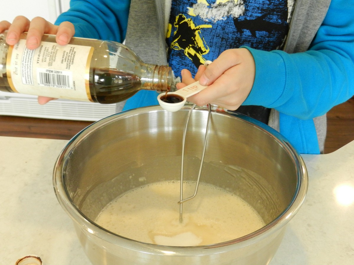 Making Norwegian pancake batter, measuring vailla extract