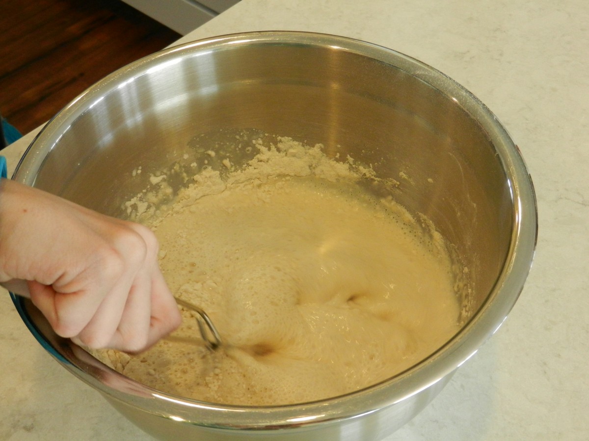 Making Norwegian pancake batter, mixing flour and milk
