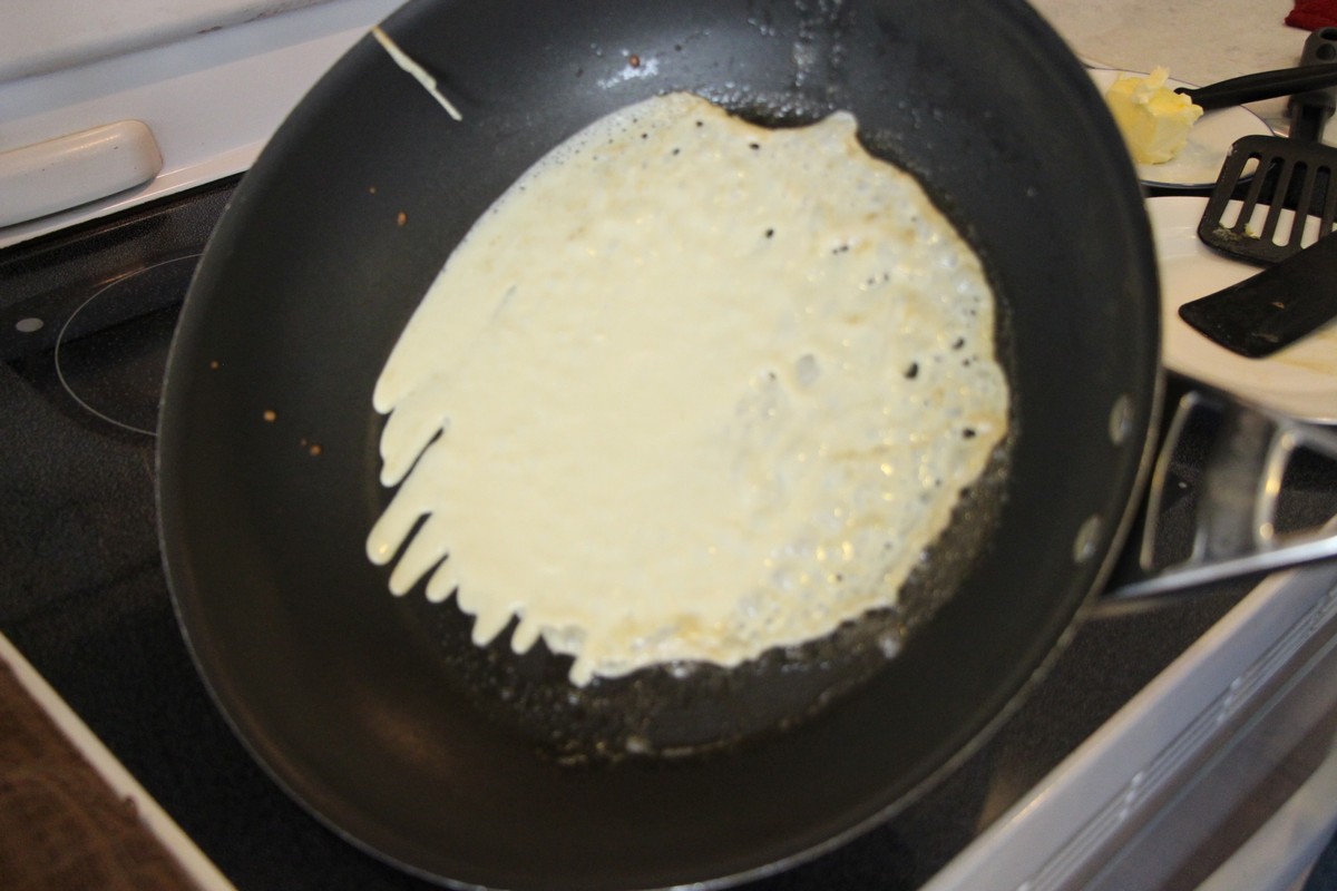 Norwegian pancakes, tilting skillet to spread batter