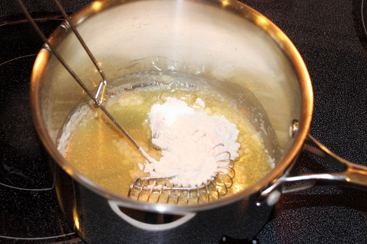 Making roux for white sauce. Butter and flour.