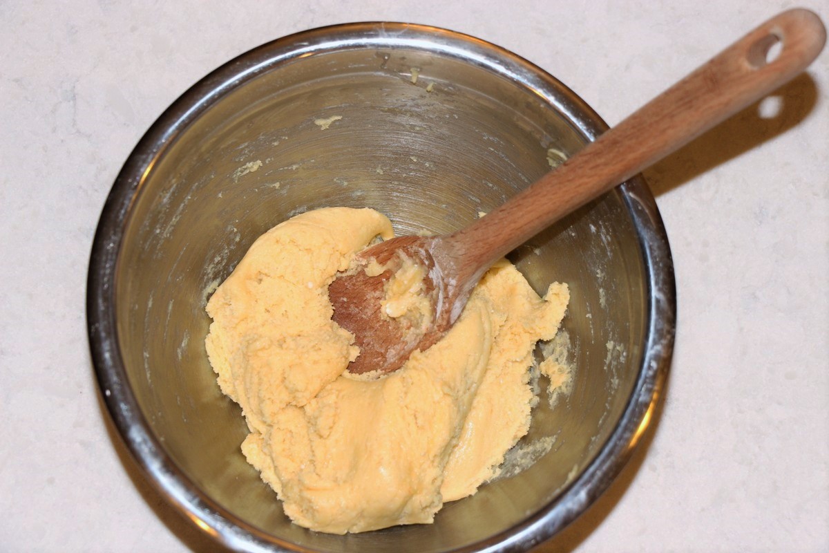 Mixing together dough for cake crust.
