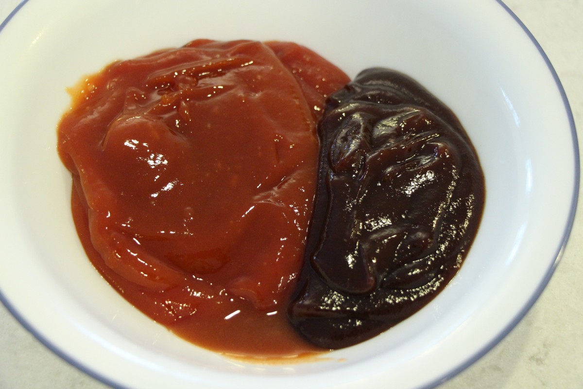 Mixing ketchup and BBQ sauce for meatloaf topping