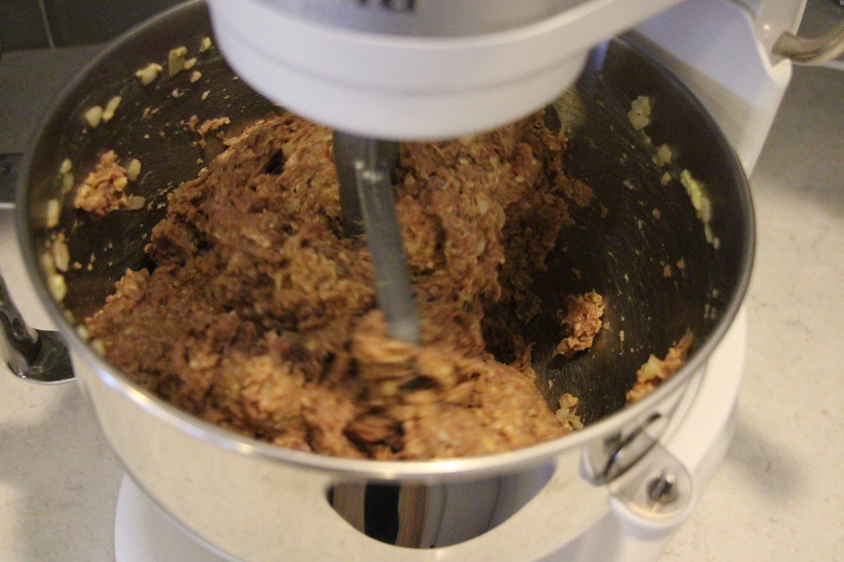 Mixing meat and other ingredients for Grandma's old fashioned meatloaf recipe. Picture tutorial.