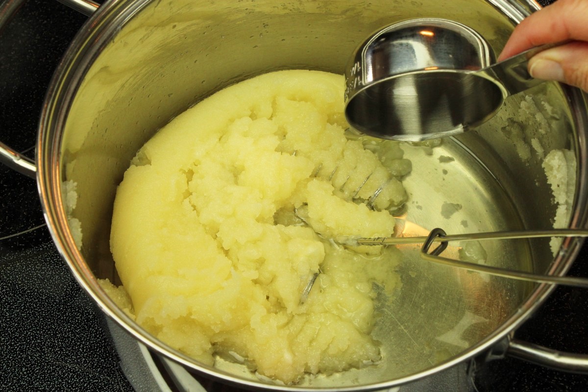 Adding oil to sugar cookie batter.