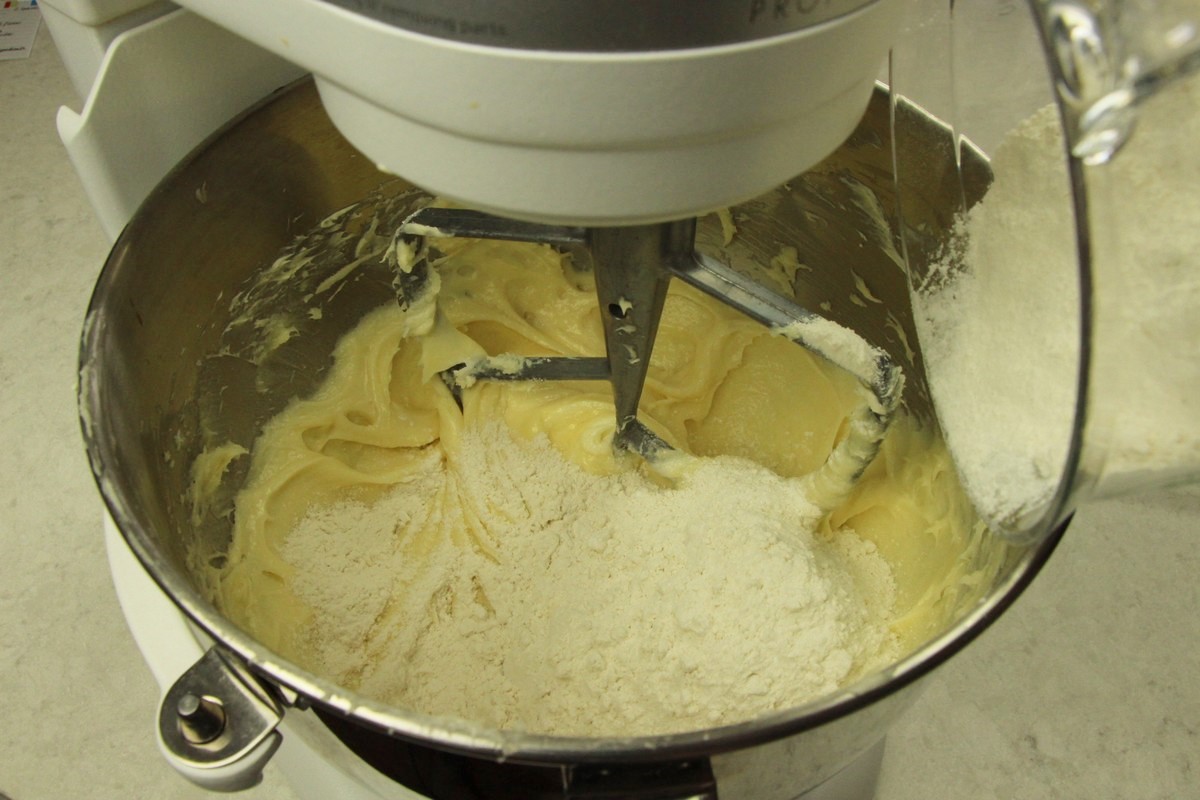 Mixing batter for flavorful sugar cookies.