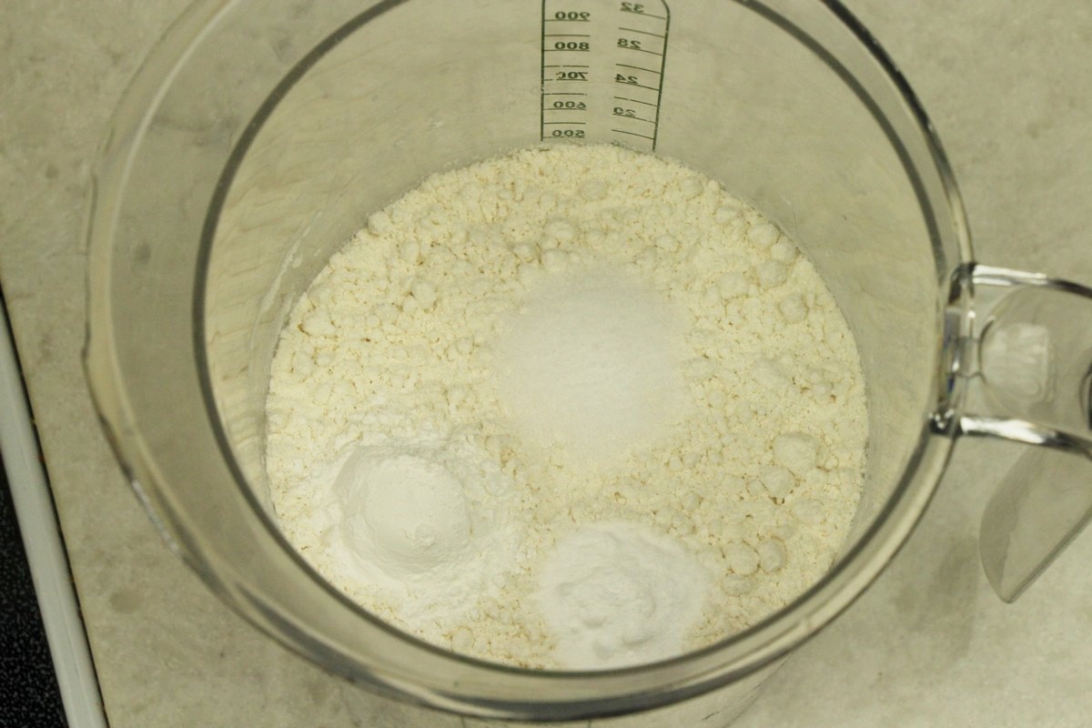 Mixing flour, salt, baking soda, baking powder for sugar cookies