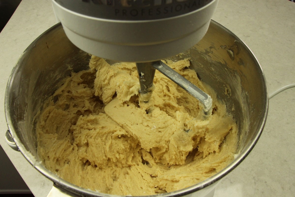 Sugar cookie dough being mixed.