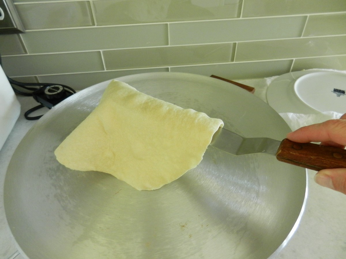 Flipping a delicious, homemade flour tortilla; picture recipe