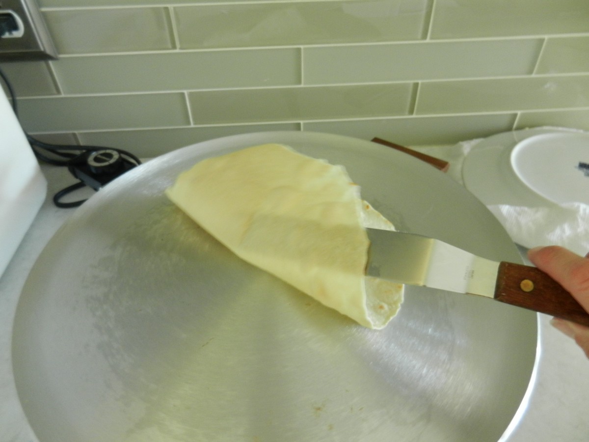 Flipping homemade flour tortillas; picture recipe
