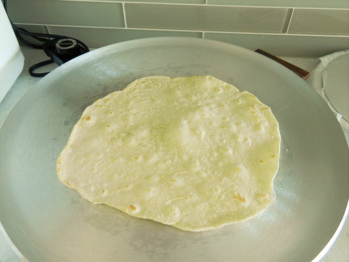 Frying soft, homemade flour tortillas; picture recipe