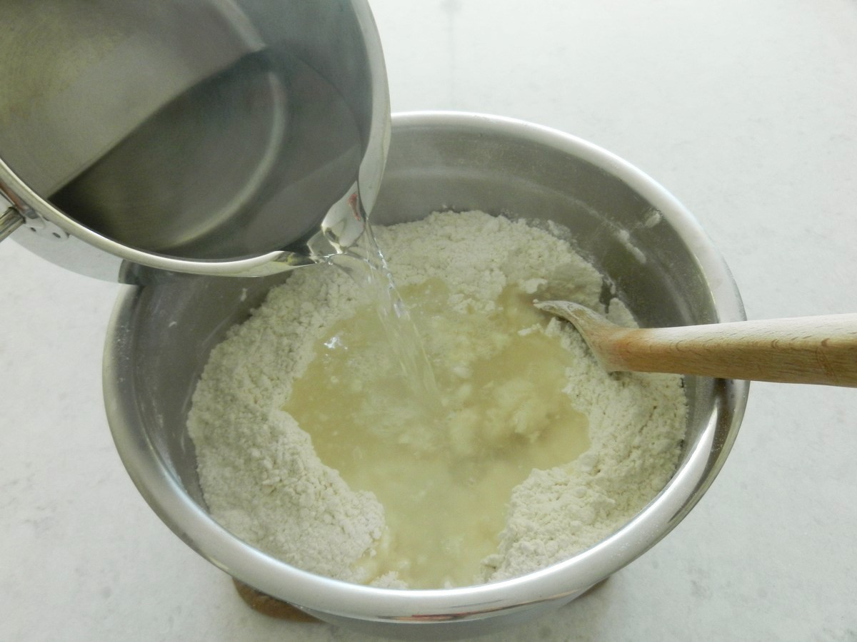 Hot water poured into flour mixture. Making soft, flavorful flour tortillas. Recipe plus pictures.