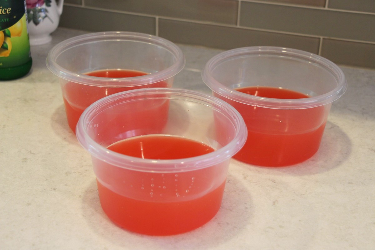 Making jumbo ice cubes for the best-ever flavored lemonade on a budget. Recipe.