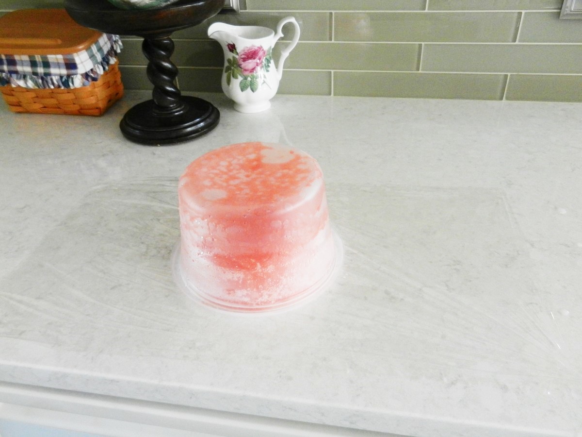 Freezing pink lemonade jumbo ice cubes, ready for party.